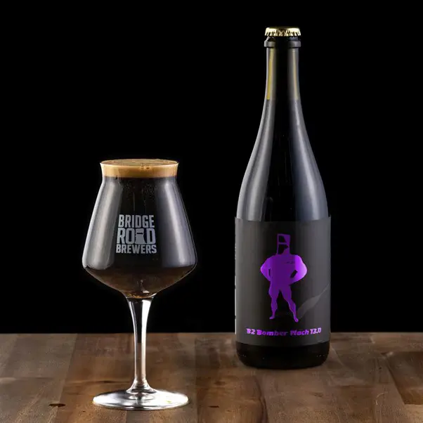 A glass and a bottle of B2 Bomber Mach 13 by Bridge Road Brewers