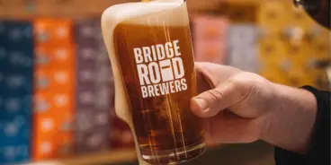 Bridge Road Brewers glass being filled with beer