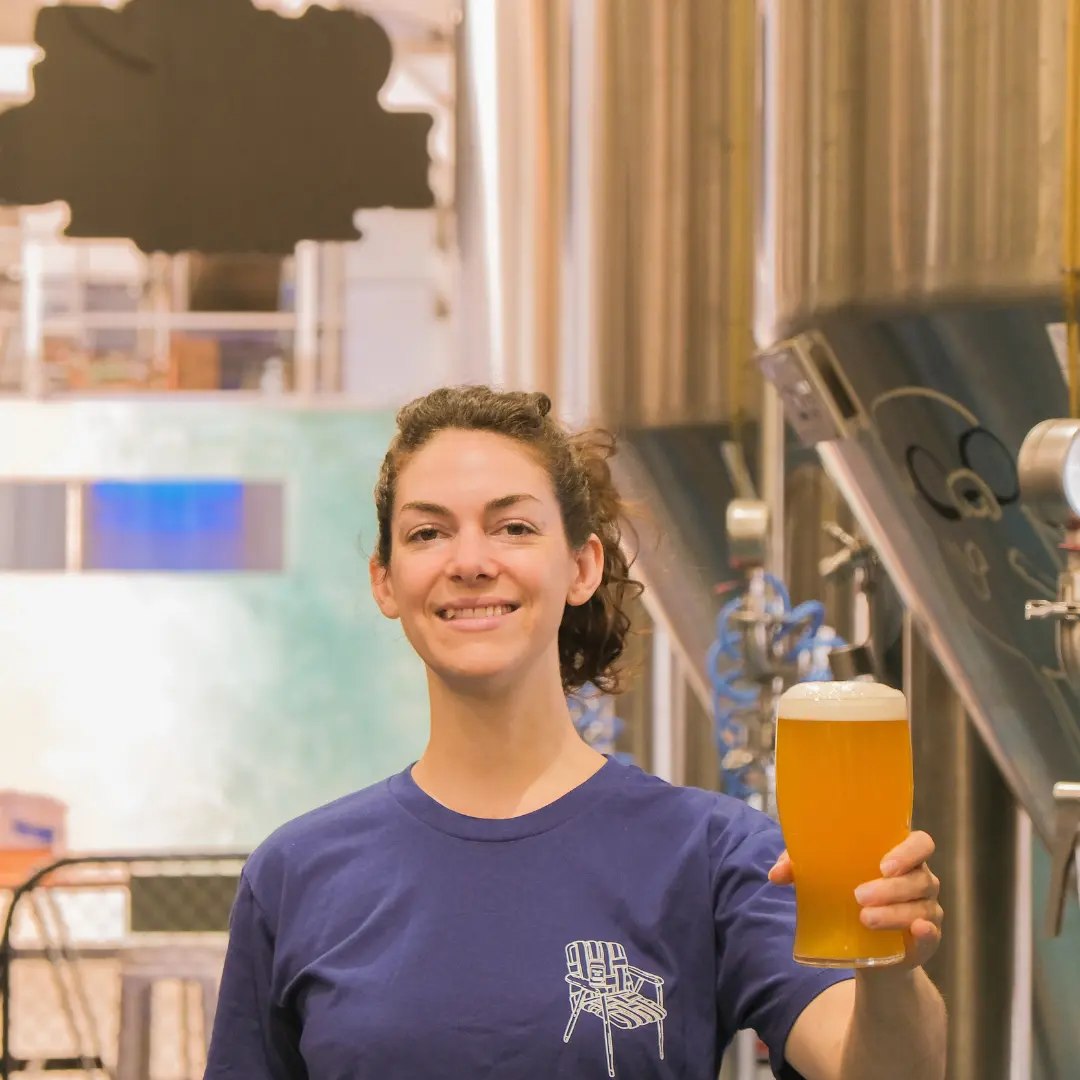 Head Brewer Simone Clements holding Gage Roads' new beer, the Twin Fin